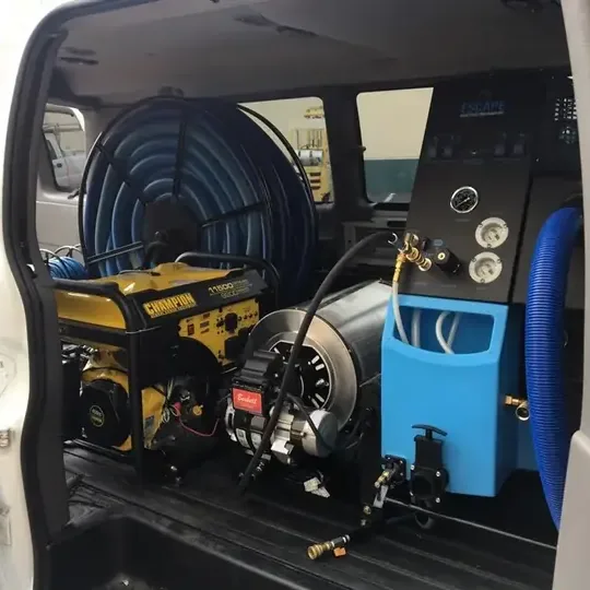Truck-mounted extraction unit and hose reel loaded for a water call