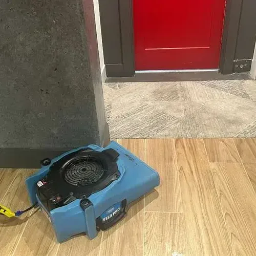 Air mover drying a tile floor, water damage restoration for Lakeland, TN