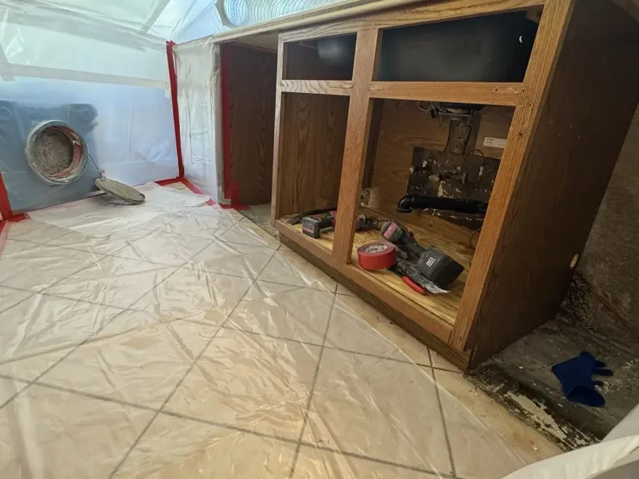 Floor damage from a pressure leak in the pipe under a concrete slab